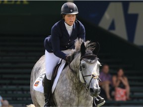 Beezie Madden and Con Taggio compete in the LaFarge Cup speed course at the Spruce Meadows North American tournament on Sunday July 9, 2017. Madden was the overall Canada 150 speed winner.