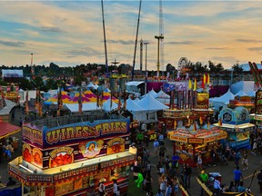 Dusk settles on the Calgary Stampede midway, Wednesday July 12, 2017.