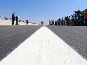 Glenmore Roadway

The City of Calgary Transportation Department General Manager Mack Logan speaks at the ceremonial opening of the newly constructed Glenmore Trail overpass above the CPR and CNR railway tracks and Western Headworks Canal on Tuesday July 18, 2017. The roadway opens to traffic early Wednesday morning