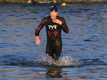 Australia's Josh Amberger was the first out of the water of Auburn Lake during the Calgary Ironman 70.3 race on Sunday July 23, 2017.