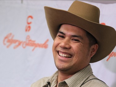 2017 Truck & Slingshot Stampede Lotteries prize winner Rommer Guinto smiles at the Stampede Lottery reception at Stampede Park on Tuesday July 25, 2017. All the lottery winners were hosted at a reception at Stampede Park.