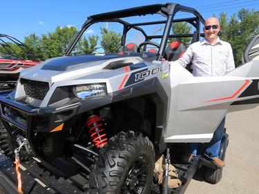 Truck and Toys Stampede Lottery prize winner Travis Friesen checks out his new toys on Tuesday afternoon July 25, 2017. All the lottery winners were hosted at a reception at Stampede Park.