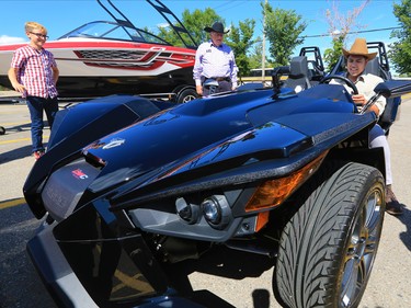 2017 Truck & Slingshot Stampede Lotteries prize winner Rommer Guinto checks out his unique new vehicle on Tuesday afternoon July 25, 2017. All the lottery winners were hosted at a reception at Stampede Park.