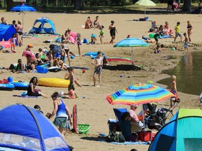 Visitors enjoy Sikome Lake on a hot afternoon. This year, supervisory staff are called monitors, not lifeguards.