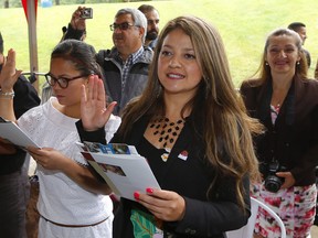 Edith Jerez from Colombia, became a Canadian citizen today during the Citizenship Ceremony at the Calgary Stampede. AL CHAREST/POSTMEDIA