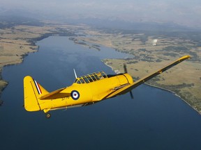 Drew Watson, accompanied by David Watson, pilots the Yellow Thunder Harvard formation team over Ghost Lake, west of Calgary on Friday, July 28, 2017. The team was practicing for the Wings over Springbank AirShow this Saturday and Sunday. The show has lmore than 60 types of aircraft and will also feature a performance from the Canadian Forces Snowbirds.  Jim Wells/Postmedia

Postmedia Calgary
JimWells/Postmedia