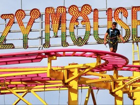 The Crazy Mouse Roller Coaster is inspected before opening up to the public Saturday morning as Stampede officials have a media briefing on ride safety on the Midway at the 2017 Calgary Stampede. AL CHAREST/POSTMEDIA