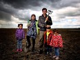 Recent Syrian refugees Mohamed El Daher, 39 and his wife Nahiama, 32, with their children Aicha, 6, Raibeh, 5 and Aber, 3, at a borrowed plot of land they are farming near Calgary.
