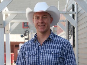 Charles McMichael, the organizer of Gay Day, pose in front of Nashville North on the Stampede grounds. Gay Day is an unofficial party held on the first Saturday of Stampede that invites members of the city's LGBTQ community to party together.Wednesday July 5, 2017 in Calgary, AB. DEAN PILLING/POSTMEDIA