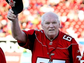 Former Stampeder great George Hanson, who played in the first game at McMahon Stadium, waves to the crowd during ceremonies to mark the 50th anniversary of McMahon Stadium, on Sunday August 15 2010. Postmedia Archive Photo