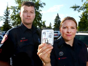 Constables and Wes Burnside, left, and Helen Schott were responsible for saving the life of a driver who suffered an opiate overdose behind the wheel on Thursday.