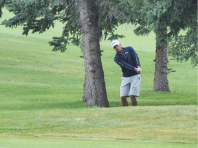 Thanks to this punch-shot from between two trees, Brett Hogan won the 2017 Sun Life Alberta Men's Amateur Championship with a birdie on the second playoff hole at Ponoka Community Golf Club. The Calgarian has claimed the title twice in a three-year span. (Wendy Davies/Alberta Golf)
