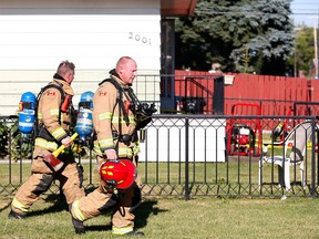 Calgary firefighters at the scene of a house fire at 19th Avenue and 45th Avenue S.E.
