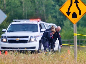 Officers investigate after a body was found in a ditch along Hwy. 22.