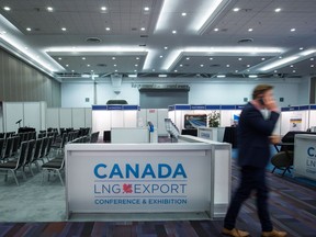 A man speaks on his phone while attending the May 2016 Canada LNG Export Conference in Vancouver, B.C.