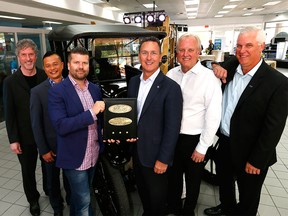 L-R, Pat Priestner, CEO, Canada One, Justin Chang, General Manager, Maclin Ford, Brad Jinjoe, Dealer Principal, Maclin Ford, Mark Buzzell, President and CEO, Ford Motor Company of Canada, Ltd., Paul Walters, President, Canada One and Gerald Wood, General Manager, Western Region, Ford Canada, pose by a 1917 Ford Model T as Maclin Ford celebrated its 100th anniversary in Calgary.