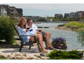 Erhardt and Arvella Tutto enjoying a relaxing afternoon on the dock behind their home by Calbridge Homes in Mahogany.