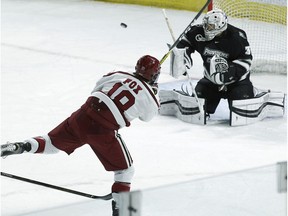 Providence goalie Hayden Hawkey (31) makes a save on a shot by Harvard's Adam Fox (18) during the first period of an NCAA regional men's college hockey tournament game, Friday, March 24, 2017 in Providence, R.I.