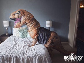 Calgary newlywed Nicole Stein poses for a sexy boudoir photo shoot wearing an inflatable tyrannosaurs rex costume, which she did as a joke for her husband prior to her July 1 wedding. The photos have since gone viral, getting attention for around the globe. Photos courtesy Josh & Kissy Photography