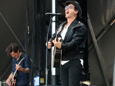 Guitarist Steve Mazur and vocalist Raine Maida of Our Lady Peace performs at Fort Calgary during the Oxford Stomp. This year's event features music from Serena Ryder, Our Lady Peace and Corey Hart.Friday July 14, 2017 in Calgary, AB. DEAN PILLING/POSTMEDIA