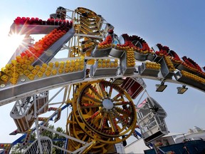 One of the most requested rides, The Zipper, one of the many old favourites on the midway at the Calgary Stampede in downtown Calgary, Alta. on Friday July 10, 2015. Stuart Dryden/Postmedia Network