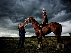 Team Lone Wolf's Aaron Good Rider, left and jockey Kal Jackson pictured at Piikani Nation on Wednesday June 28, 2017, will be competing during the Indigenous relay races at the Calgary Stampede. It is a first for the Stampede and is a demonstration sport running three nights starting July 11 at this year's event. Leah Hennel/Postmedia