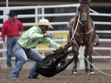 Cory Solomon of Prairie View, Texas during his win in tie-down roping at the Calgary Stampede on Sunday July 16, 2017. Leah Hennel/Postmedia