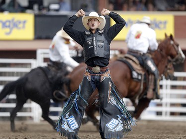 Zeke Thurston of Big Valley, Alberta wins the saddle bronc championship at the calgary Stampede on Sunday July 16, 2017. Leah Hennel/Postmedia
