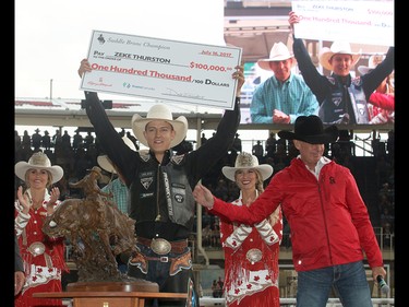 2017 Calgary Stampede Saddle Bronc Champion Zeke Thurston from Big Valley, AB, is presented with a cheque for $100,000 after winning the final day at the Stampede Rodeo. Sunday July 16, 2017 in Calgary, AB. DEAN PILLING/POSTMEDIA