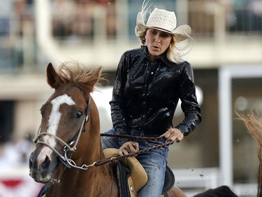 Tiany Schuster of Krum, Texas during her winning ride in barrel racing at the Calgary Stampede on Sunday July 16, 2017. Leah Hennel/Postmedia
