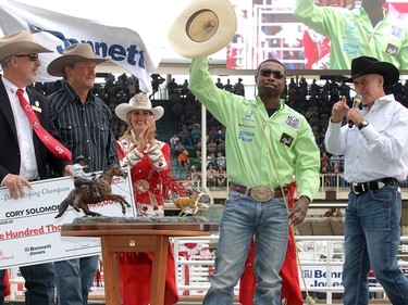 2017 Calgary Stampede Tie-Down Roping Champion Cory Solomon is presented with a cheque for $100,000 after winning the final day at the Stampede Rodeo. Sunday July 16, 2017 in Calgary, AB. DEAN PILLING/POSTMEDIA