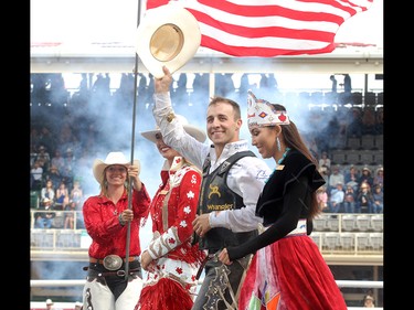 2017 Calgary Stampede Bull Riding Champion Sage Kimzey from Strong City, OK is presented with a cheque for $100,000 after winning the final day at the Stampede Rodeo. Sunday July 16, 2017 in Calgary, AB. DEAN PILLING/POSTMEDIA