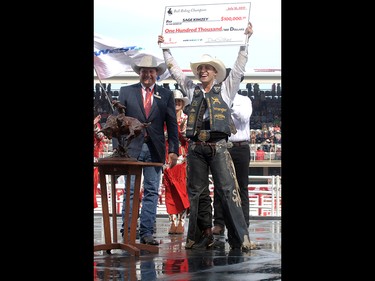 2017 Calgary Stampede Bull Riding Champion Sage Kimzey from Strong City, OK is presented with a cheque for $100,000 after winning the final day at the Stampede Rodeo. Sunday July 16, 2017 in Calgary, AB. DEAN PILLING/POSTMEDIA