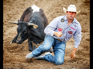 Louisiana bulldogger Tyler Waguespack wins the $100,000 in the steer wrestling event during the final day of the rodeo at the 2017 Calgary Stampede. AL CHAREST/POSTMEDIA