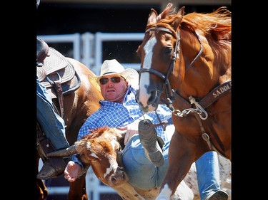Oregon bulldogger Stockton Graves during the steer wrestling event at the Calgary Stampede rodeo. AL CHAREST/POSTMEDIA