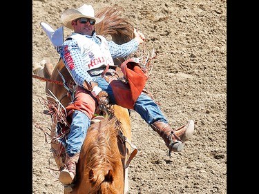 Utah cowboy Mason Clements rides Paradise Moon to a score of 87.50 during the bareback event at the 2017 Calgary Stampede rodeo. AL CHAREST/POSTMEDIA