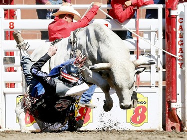 Tanner Byrne from Prince Albert, SK, riding Milky Chance has some problems during the bull riding event on day 7 of the 2017 Calgary Stampede rodeo on Thursday July 13, 2017. DARREN MAKOWICHUK/Postmedia Network