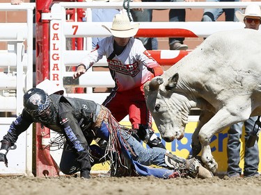 Tanner Byrne from Prince Albert, SK, riding Milky Chance has some problems during the bull riding event on day 7 of the 2017 Calgary Stampede rodeo on Thursday July 13, 2017. DARREN MAKOWICHUK/Postmedia Network