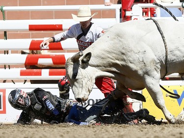 Tanner Byrne from Prince Albert, SK, riding Milky Chance has some problems during the bull riding event on day 7 of the 2017 Calgary Stampede rodeo on Thursday July 13, 2017. DARREN MAKOWICHUK/Postmedia Network