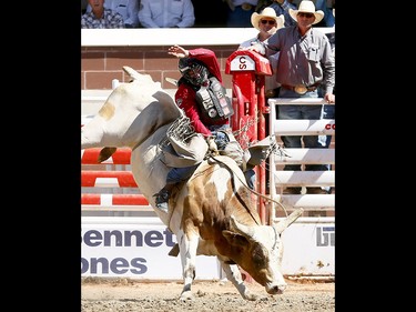 Brennon Eldred from Sulphur, OK, riding Evil Genius wins the bull riding event on day 7 of the 2017 Calgary Stampede rodeo on Thursday July 13, 2017. DARREN MAKOWICHUK/Postmedia Network