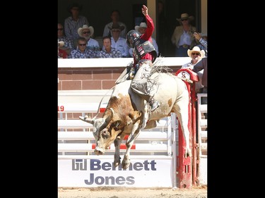 Brennon Eldred from Sulphur, OK, riding Evil Genius wins the bull riding event on day 7 of the 2017 Calgary Stampede rodeo on Thursday July 13, 2017. DARREN MAKOWICHUK/Postmedia Network