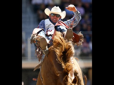 Mason Clements from Santaquin, UT, riding Paradise Moon wins the Bareback event on day 7 of the 2017 Calgary Stampede rodeo on Thursday July 13, 2017. DARREN MAKOWICHUK/Postmedia Network