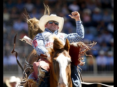 Mason Clements from Santaquin, UT, riding Paradise Moon wins the Bareback event on day 7 of the 2017 Calgary Stampede rodeo on Thursday July 13, 2017. DARREN MAKOWICHUK/Postmedia Network