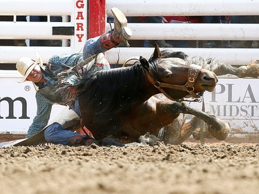 Calder Peterson from Glenworth, SK, riding during  Unfrisky during the Novice Bareback event on day 6 of the 2017 Calgary Stampede rodeo on  Wednesday July 12, 2017. DARREN MAKOWICHUK/Postmedia Network