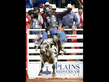 Tanner Byrne from Prince Albert, SK,  riding Rock This Way during the bull riding event on day 6 of the 2017 Calgary Stampede rodeo on  Wednesday July 12, 2017. DARREN MAKOWICHUK/Postmedia Network