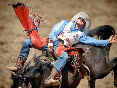 Utah cowboy Mason Clements rides Zombie Margie to a score of 86.50 point in the bareback event at the Calgary Stampede rodeo. AL CHAREST/POSTMEDIA