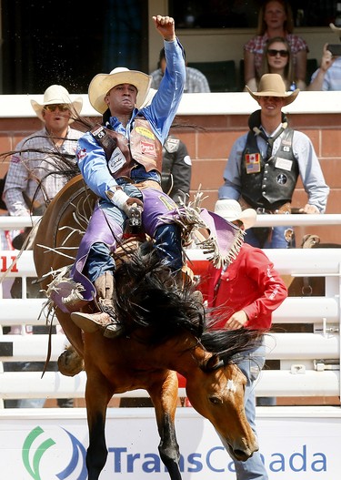 Jake Brown from Cleveland, TX, riding during Garden Party wins the Bareback event on day 6 of the 2017 Calgary Stampede rodeo on  Wednesday July 12, 2017. DARREN MAKOWICHUK/Postmedia Network