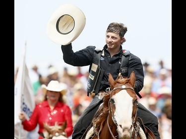 Rusty Wright from Milford, UT, riding Gone Country wins the Saddle Bronc event on day 6 of the 2017 Calgary Stampede rodeo on  Wednesday July 12, 2017. DARREN MAKOWICHUK/Postmedia Network