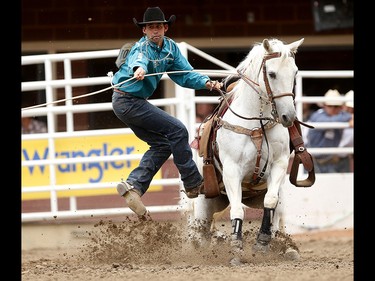 Logan Bird of Nanton, Alberta during tie-down roping at the Calgary Stampede on Saturday July 15, 2017. Leah Hennel/Postmedia