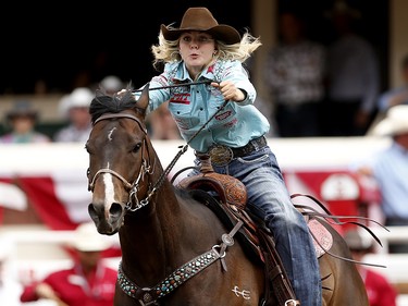 Jackie Ganter of Abilene, Texas races to the finish during barrel racing at the Calgary Stampede, Saturday July 15, 2017. Leah Hennel/Postmedia